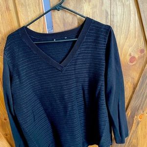 V- neck quilted black sweater.